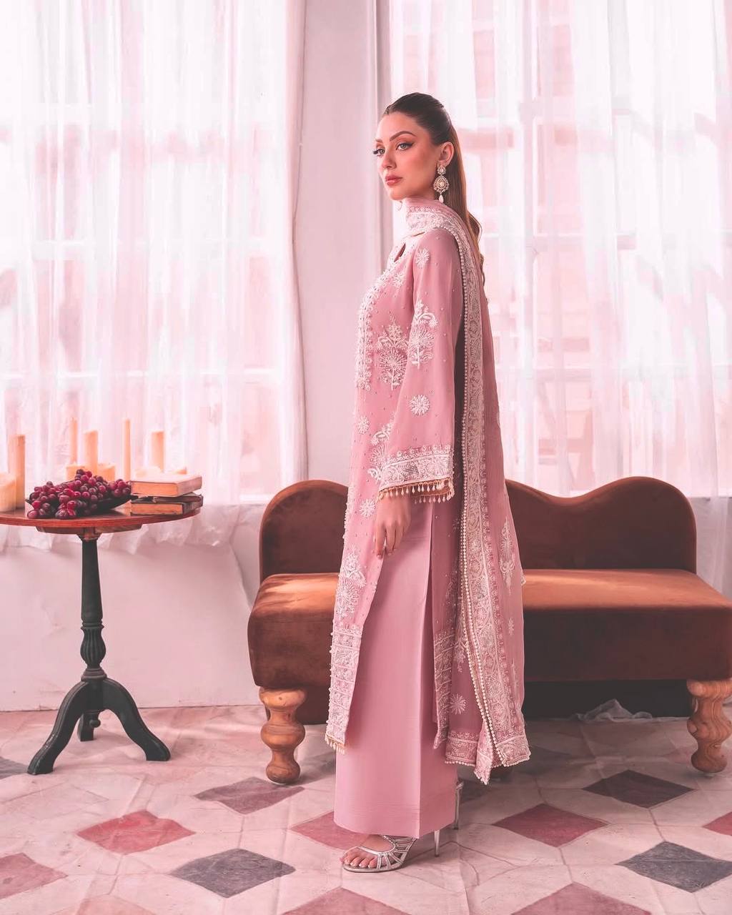 Designer blush pink thread work suit for women, featuring a straight kurta with embroidered front panel and bell sleeves, paired with palazzo pants.
