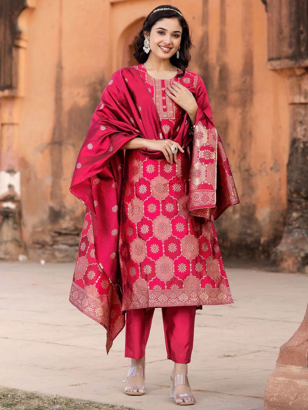 Designer fuchsia pink silk blend kurta pant set with intricate gold brocade work on the kurta and a coordinating dupatta.