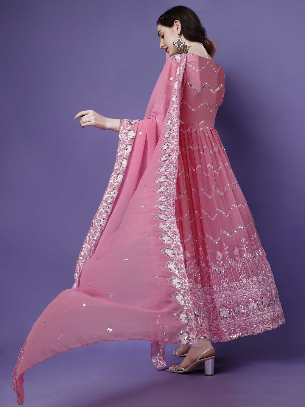 Designer party wear pink anarkali suit with full sleeves and heavy silver embroidery, perfect for weddings and receptions.
