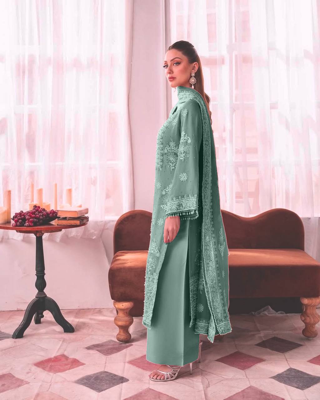 Designer pastel green thread work suit for women, featuring a straight kurta with embroidered front panel and bell sleeves, paired with palazzo pants.