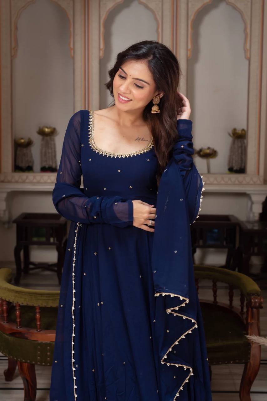 Contemporary midnight blue anarkali for women, featuring a full-length flared gown with subtle gold trim on the neckline and a matching elegant dupatta.