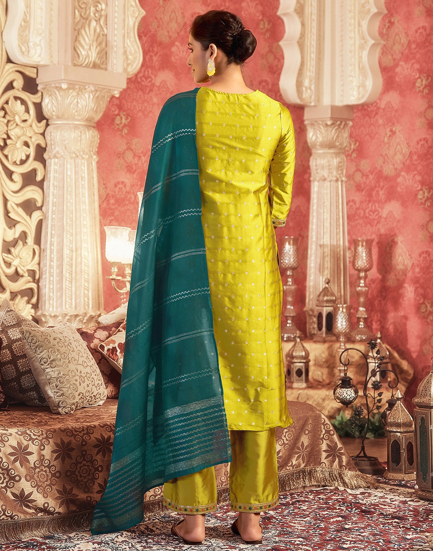 Embroidered mustard yellow kurta set with straight pants and a contrasting teal dupatta with striped weaving.