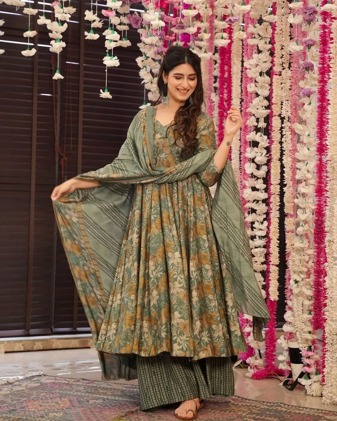 Ethnic floral green kurta palazzo set with a long flared anarkali and coordinating printed dupatta.