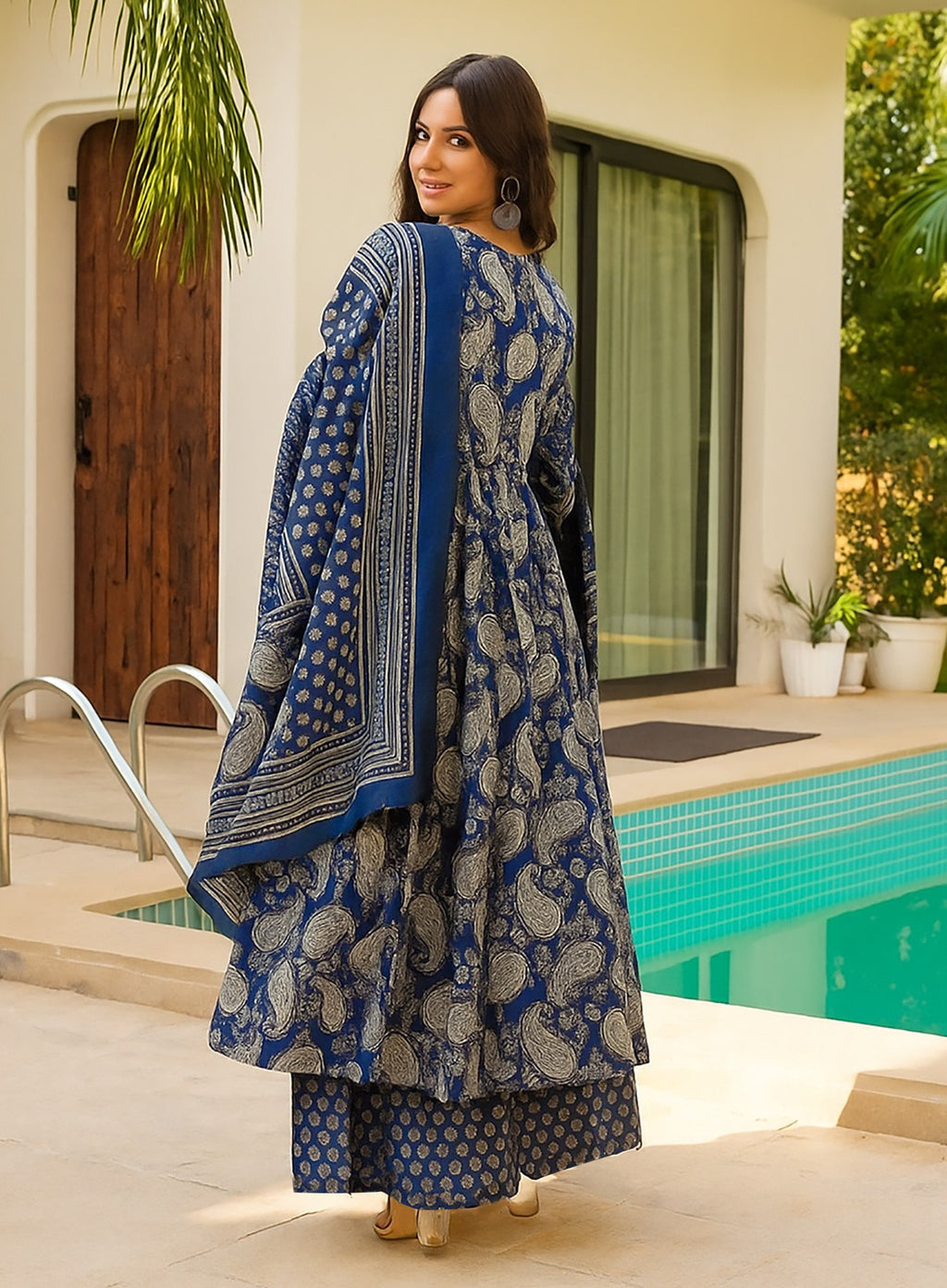 Ethnic blue anarkali kurta featuring traditional paisley print, full sleeves, and coordinated palazzo set.
