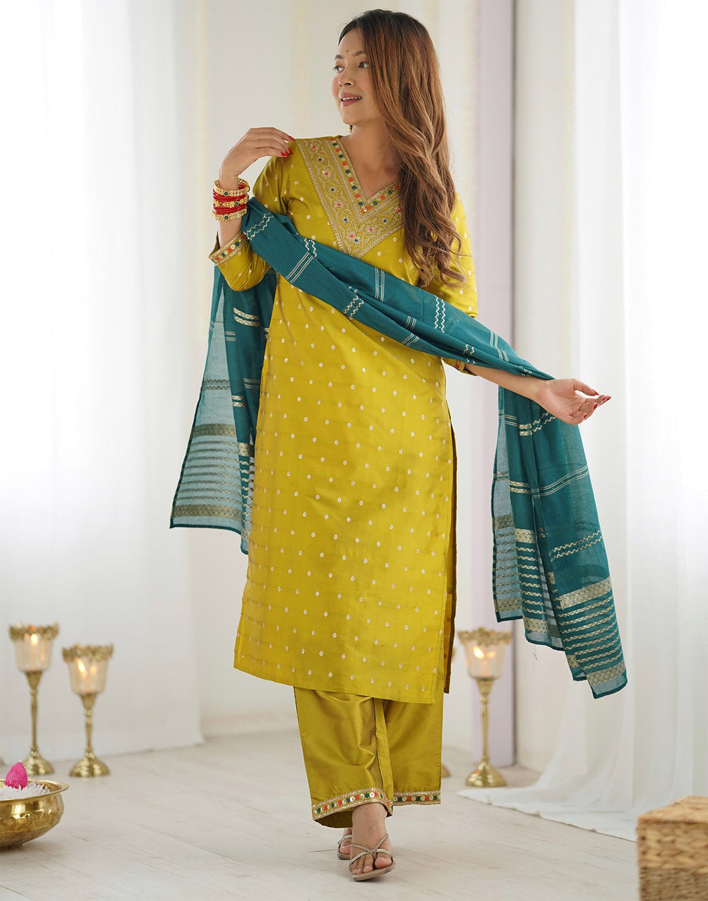 Model in a festive yellow and green kurta pant set, ideal for celebrations and traditional events.