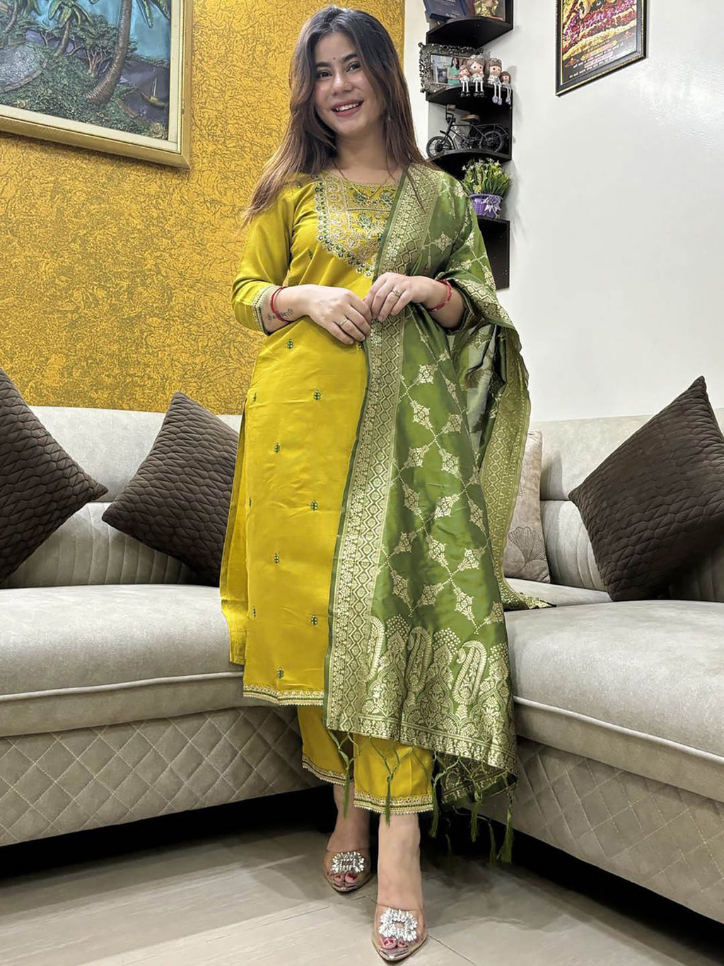 Model in a festive yellow and green Punjabi suit, perfect for celebrations and traditional events, with a rich Banarasi dupatta.