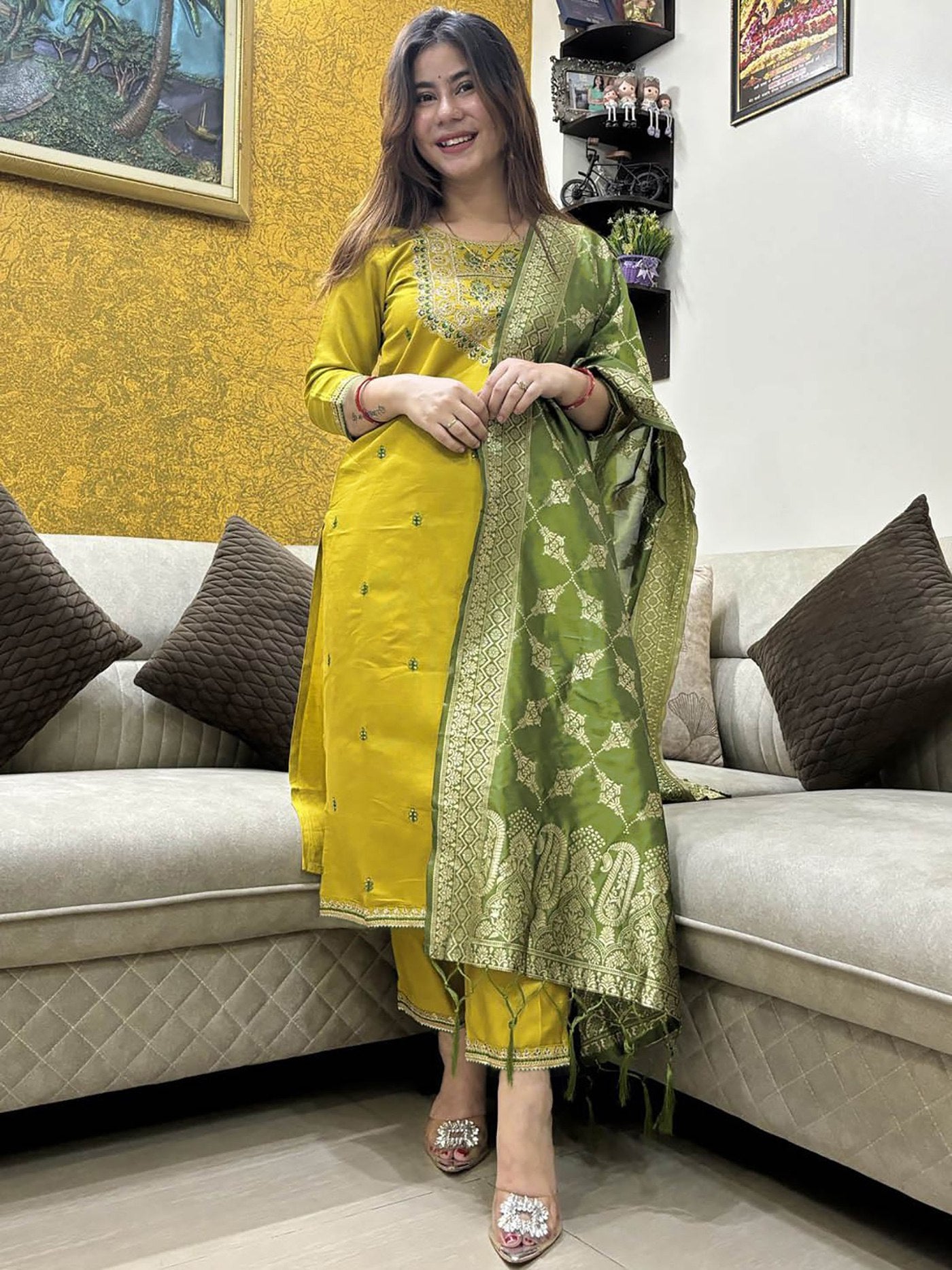 Model in a festive yellow and green Punjabi suit, perfect for celebrations and traditional events, with a rich Banarasi dupatta.
