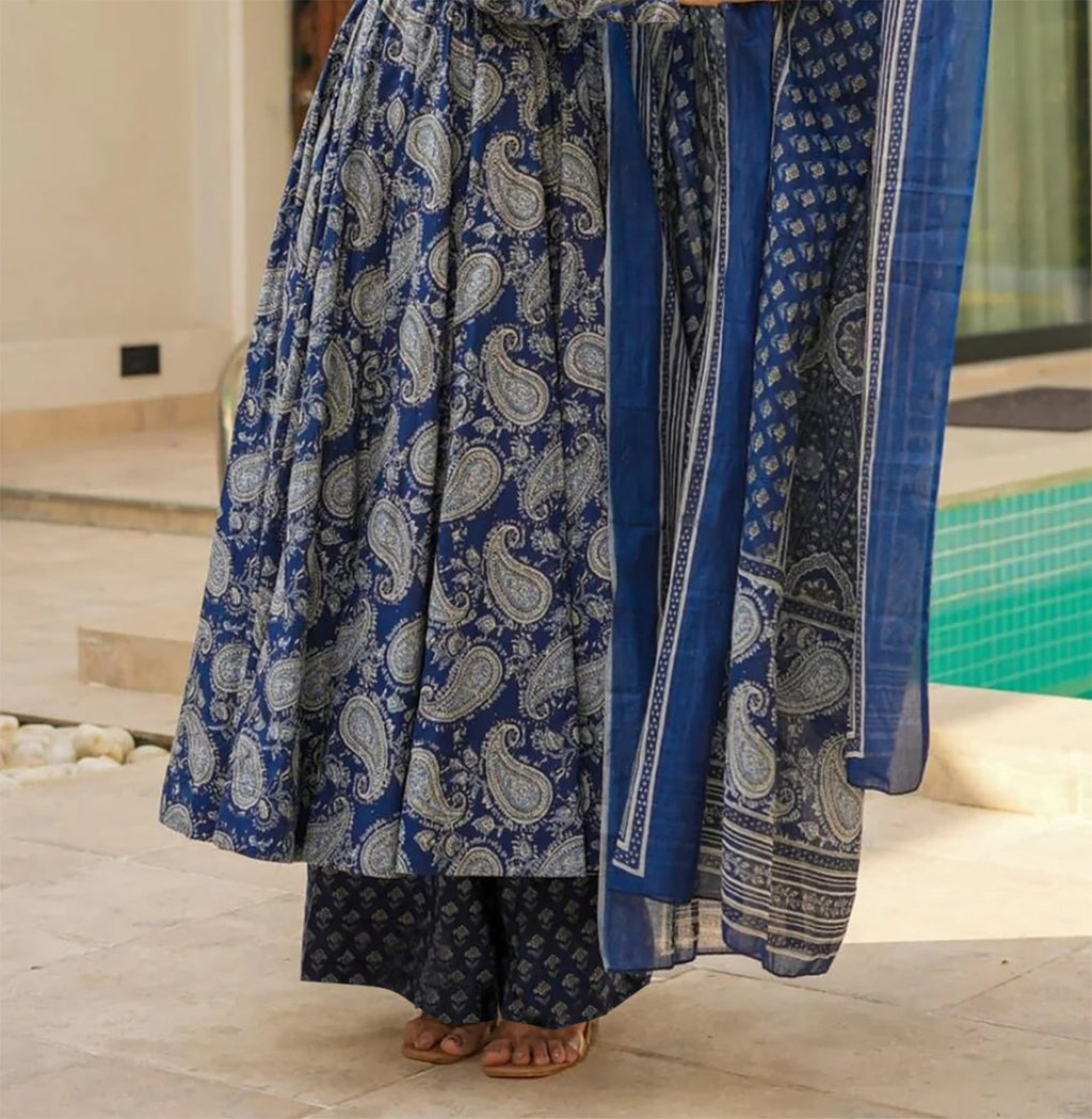 Full length view of a flared cotton anarkali with blue traditional prints and matching palazzo pants.