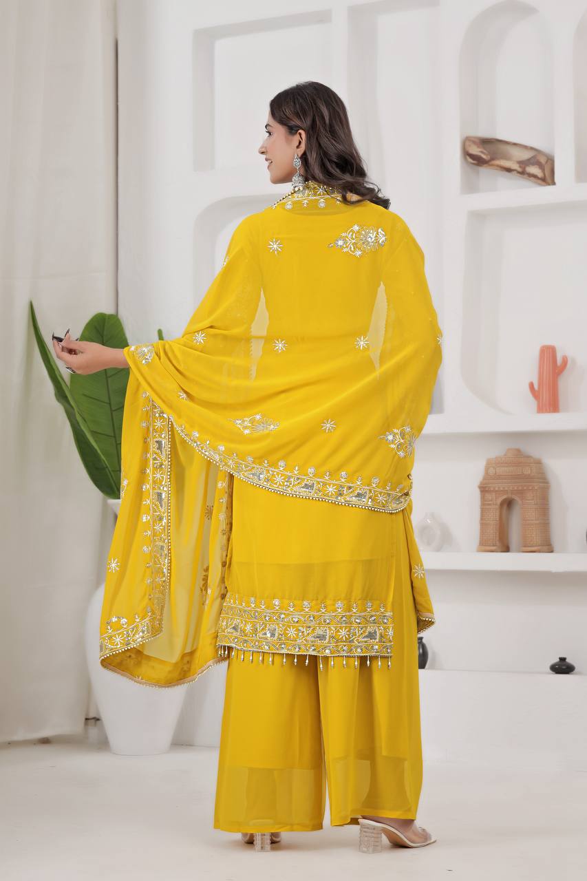 Glamorous golden yellow kurta set for women, with a heavily embroidered georgette kurta, broad palazzo, and a matching embellished dupatta.