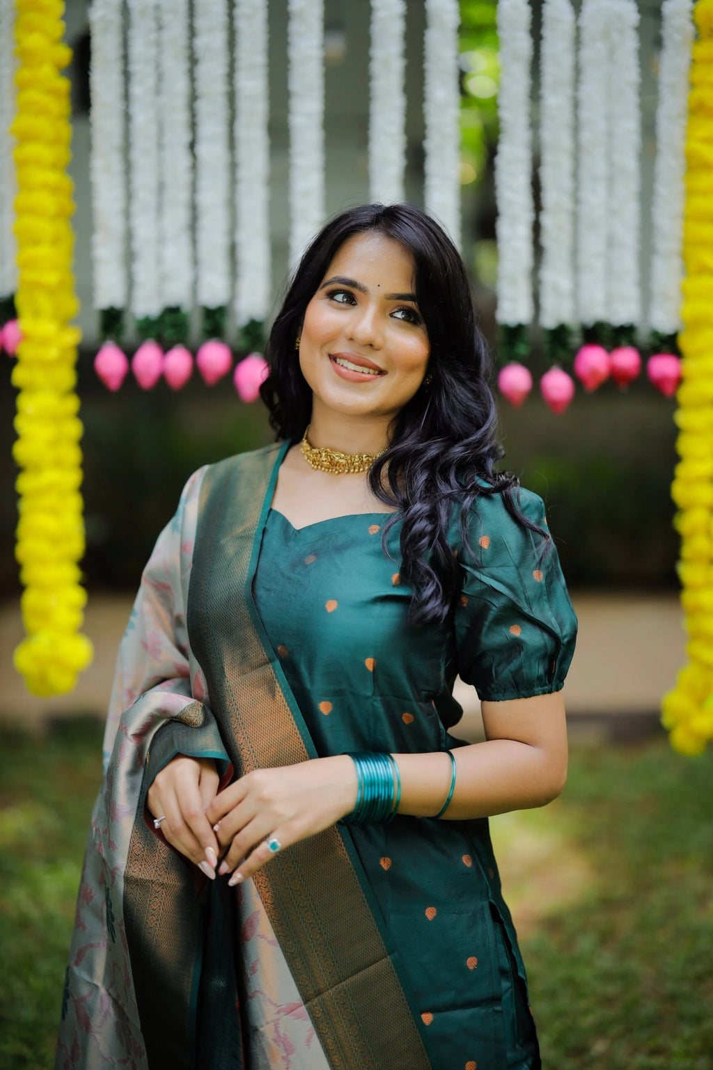 Green ethnic palazzo set for festive occasions, showcasing a silk kurta and an intricately woven Banarasi dupatta.
