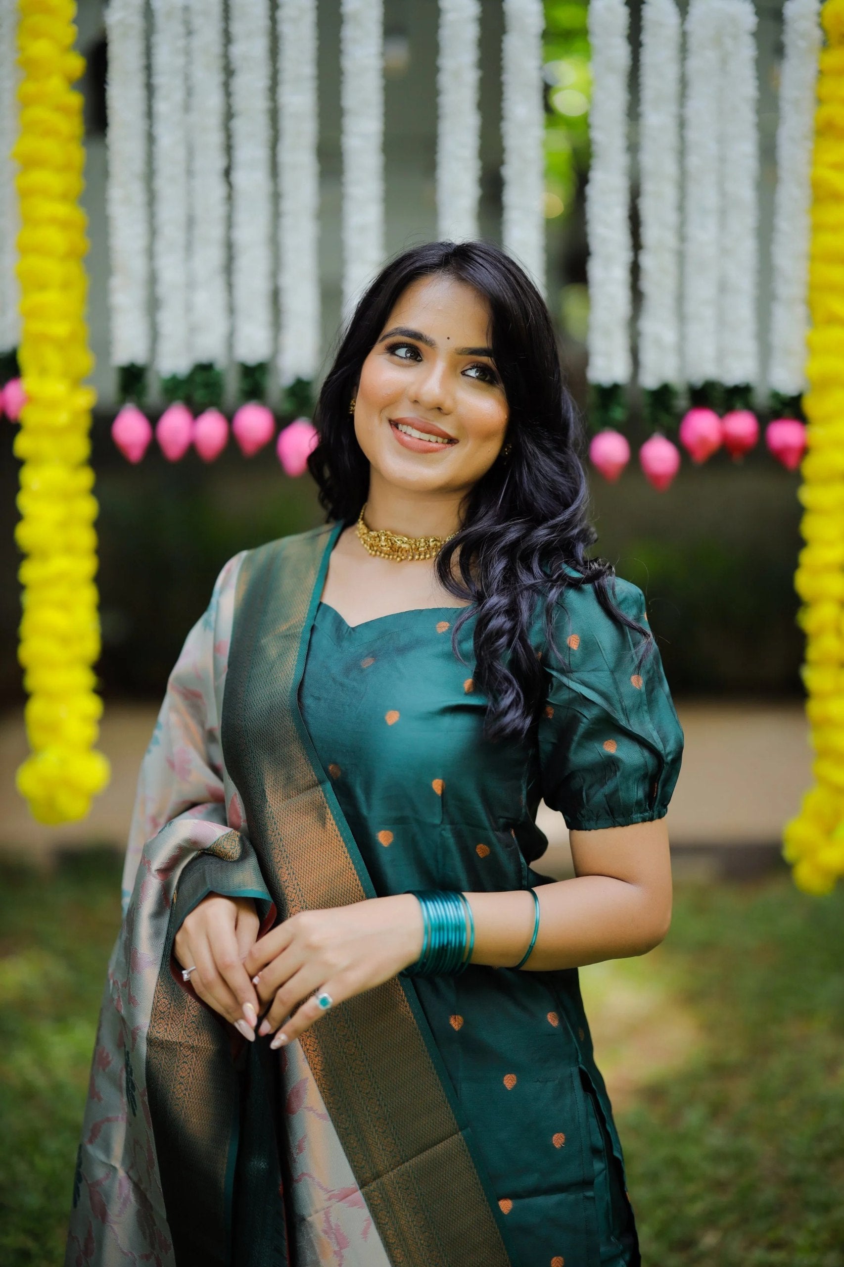 Green ethnic palazzo set for festive occasions, showcasing a silk kurta and an intricately woven Banarasi dupatta.
