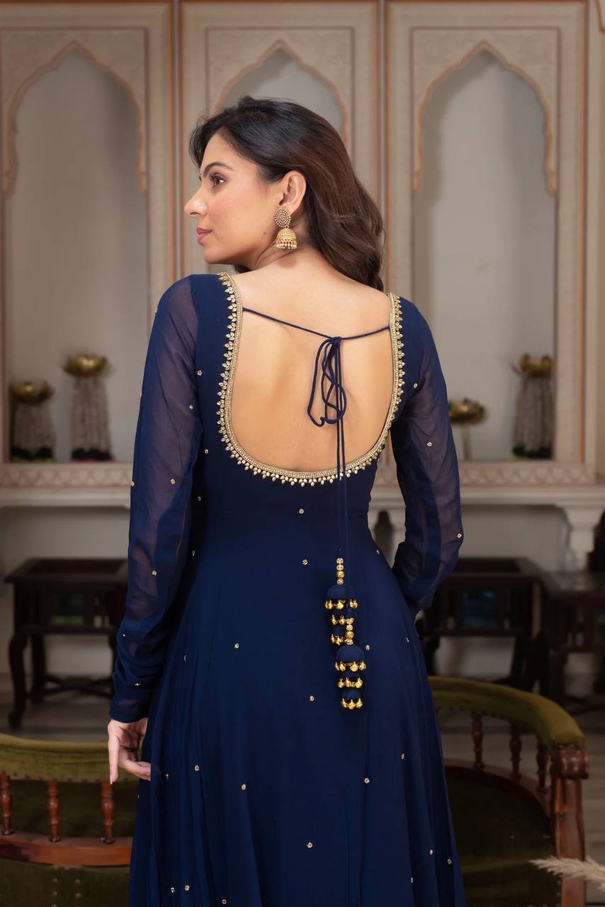 Lalily.in's navy blue anarkali ethnic gown, featuring a classic georgette fabric with subtle gold details, a large flare, and a matching gold-bordered dupatta.