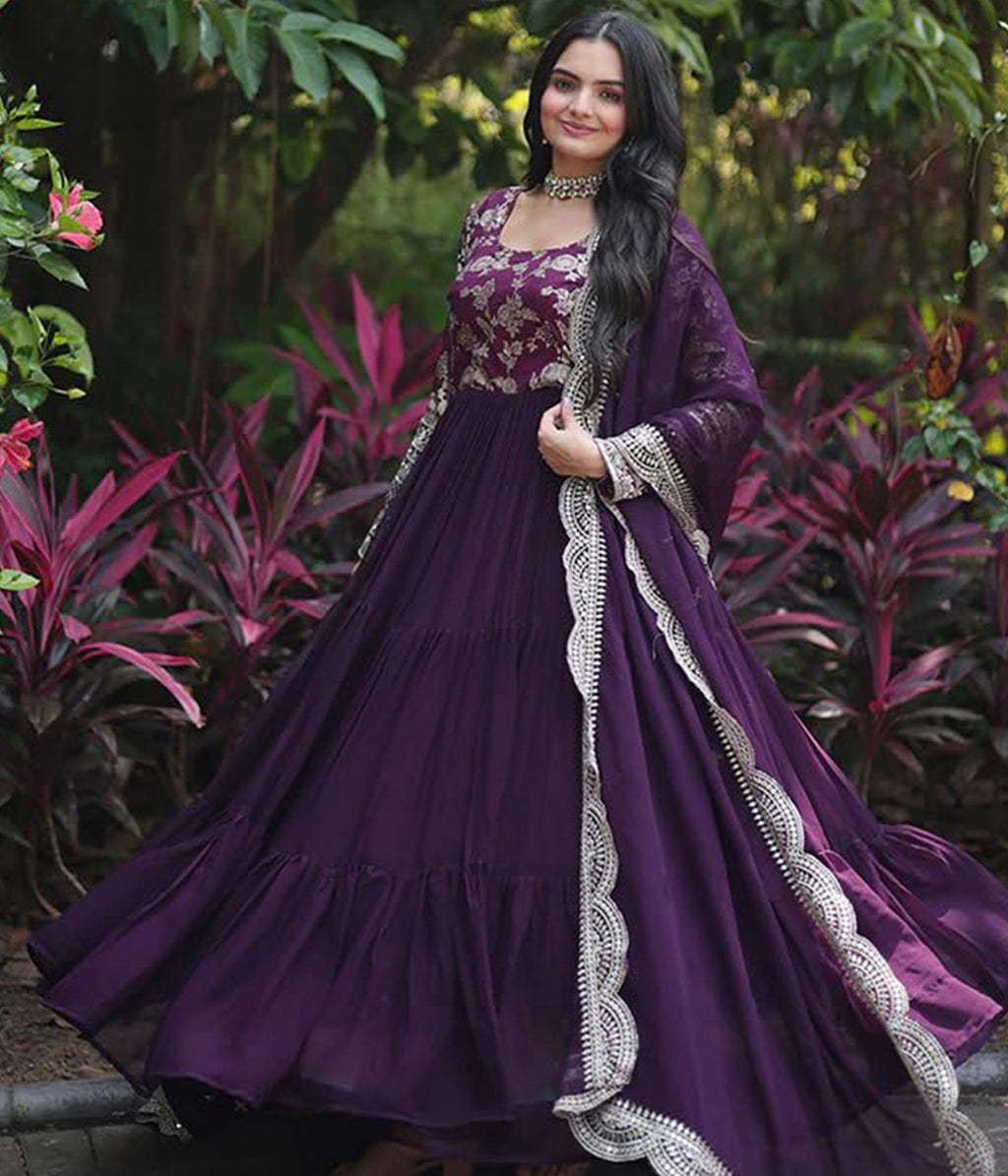 Luxury royal purple anarkali gown with full sleeves, heavy embroidery on the cuffs, and a voluminous tiered skirt, perfect for grand events.