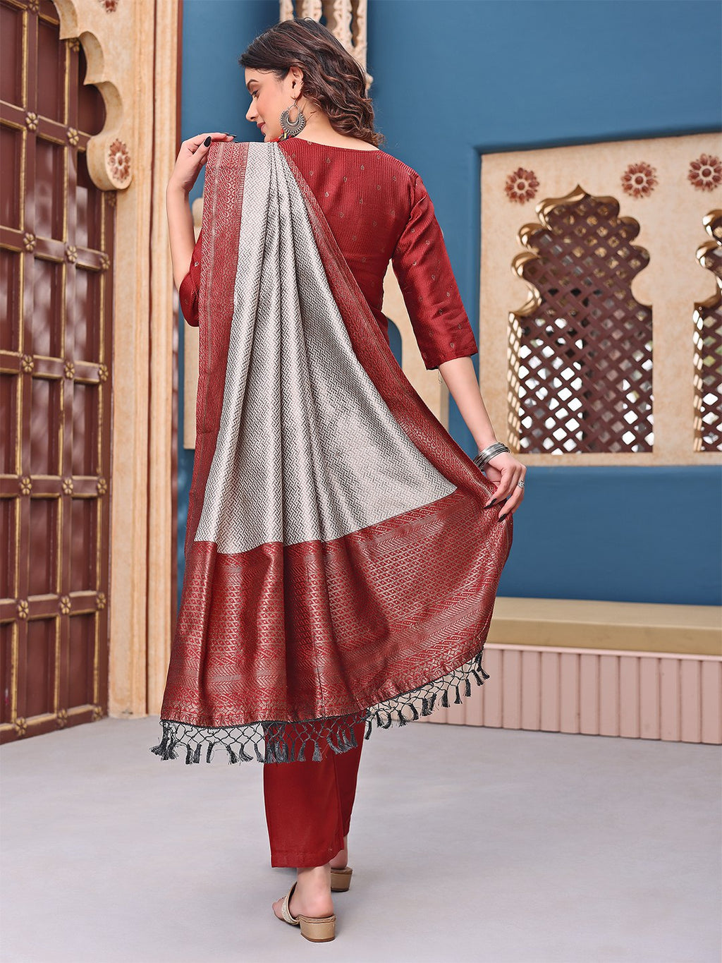 Party wear maroon kurta set with a luxurious silk blend fabric and a contrasting silver-grey dupatta, suitable for grand occasions.