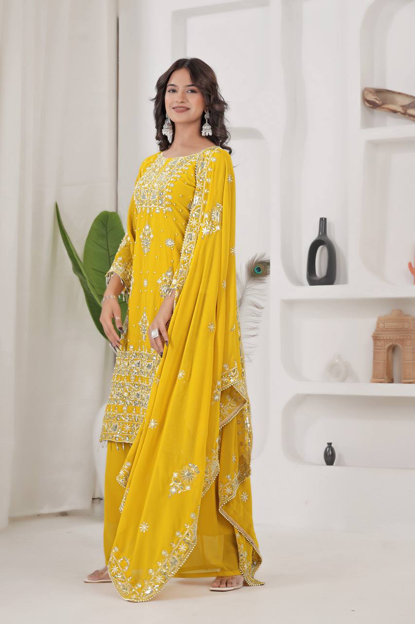 Designer Haldi/Mehendi yellow suit for women, featuring a heavily embroidered georgette kurta and broad palazzo pants, ideal for pre-wedding festivities.