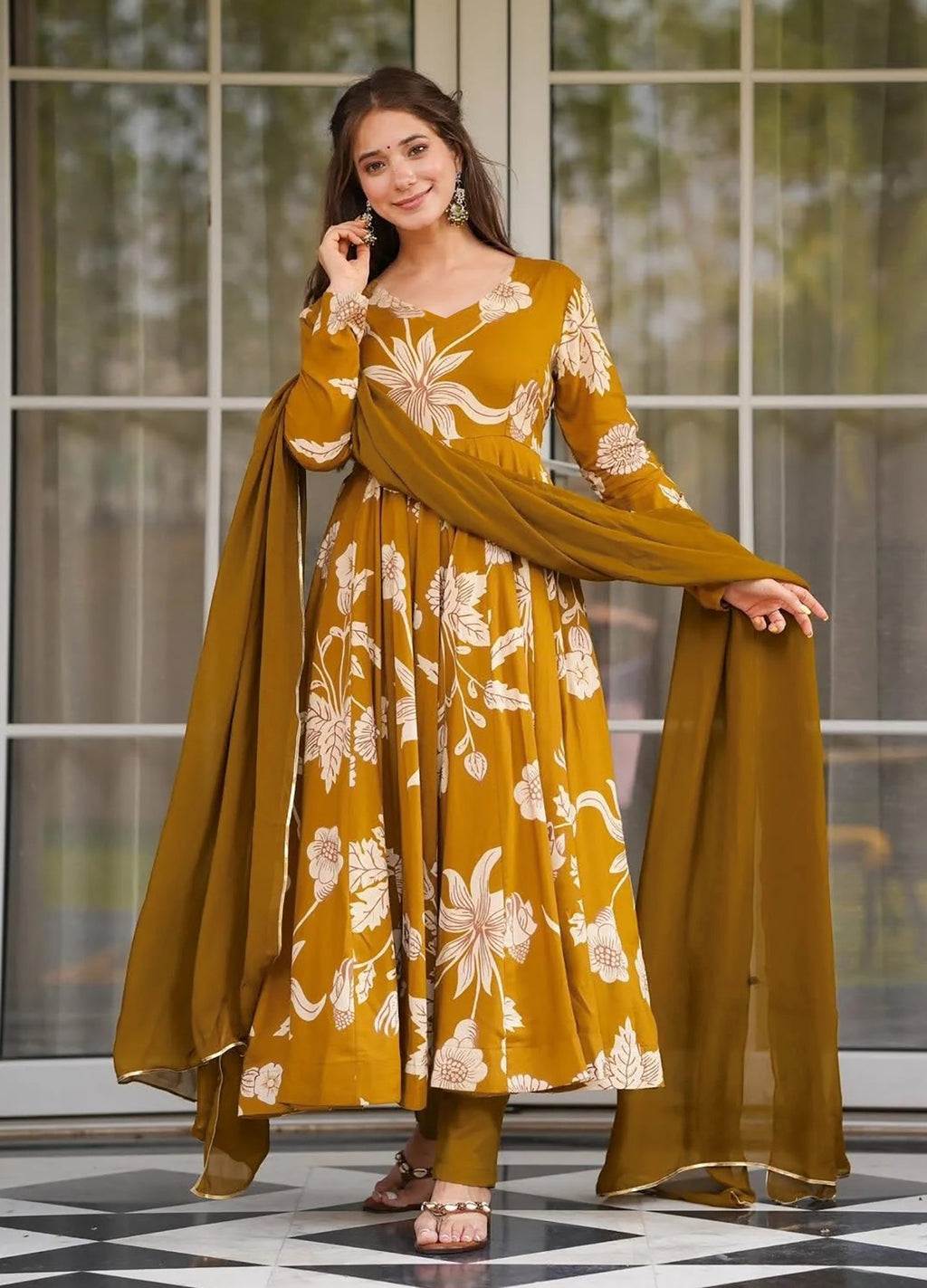 Traditional floral print anarkali in mustard gold, with all-over botanical patterns, full sleeves, and matching dupatta.