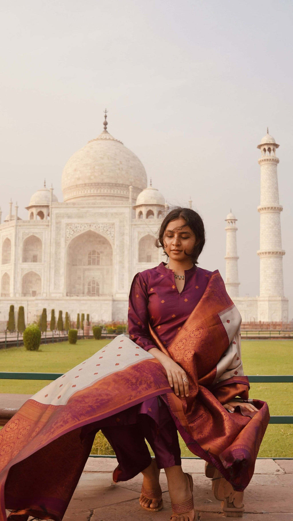Traditional rich purple silk blend suit with subtle woven patterns, straight cut kurta, and a unique dual-tone dupatta.